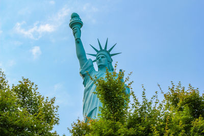 Statue of liberty against blue sky