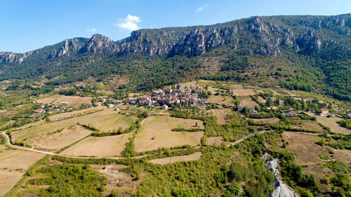 Panoramic view of agricultural landscape against sky