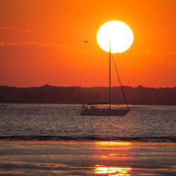 Scenic view of sea at sunset