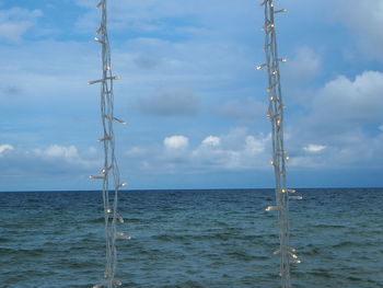 Sailboat on sea against sky