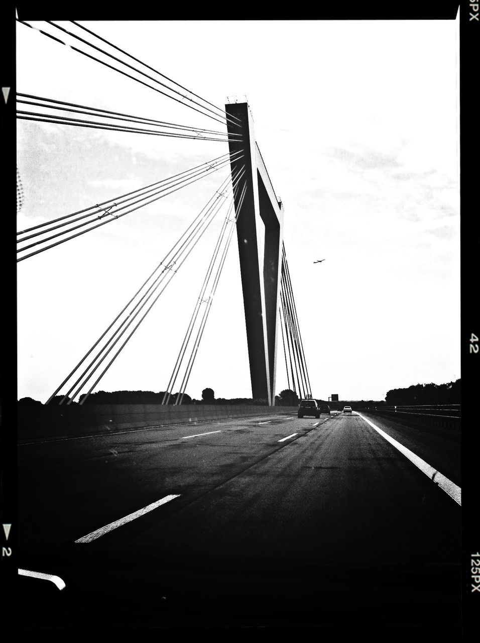 connection, transportation, built structure, architecture, bridge - man made structure, engineering, low angle view, suspension bridge, sky, the way forward, diminishing perspective, clear sky, cable, road, bridge, transfer print, cable-stayed bridge, outdoors, auto post production filter, long