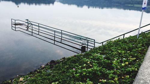 View of bridge over lake against sky
