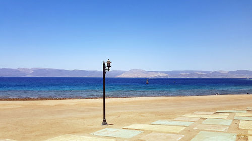 Scenic view of sea against clear blue sky