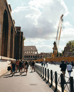 People in city against sky