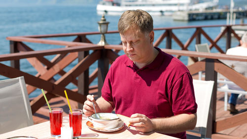 Portrait of man sitting at restaurant