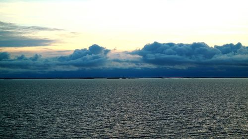 Scenic view of sea against cloudy sky