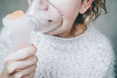 Close-up portrait of woman drinking water