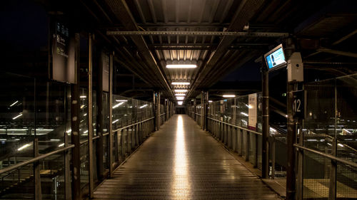 Urban scene in a train station with no people, dark atmosphere and industrial light