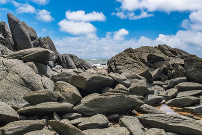 Natural large boulders lying on the beach with glimpses of the sea in axim ghana west africa