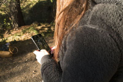 Close-up of woman using mobile phone