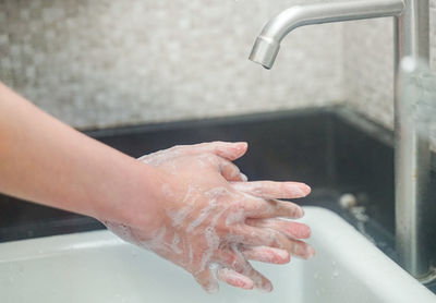 Midsection of woman in bathroom