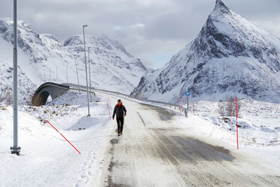 People skiing on snowcapped mountain against sky