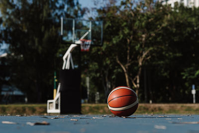 Surface level of basketball on court