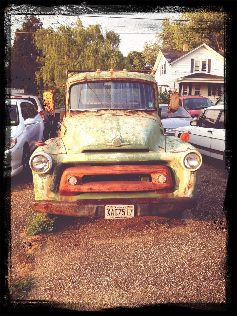 transfer print, transportation, mode of transport, land vehicle, car, auto post production filter, abandoned, obsolete, old, damaged, deterioration, travel, run-down, stationary, day, tractor, outdoors, garbage, parked, truck