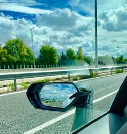 Reflection of car on side-view mirror