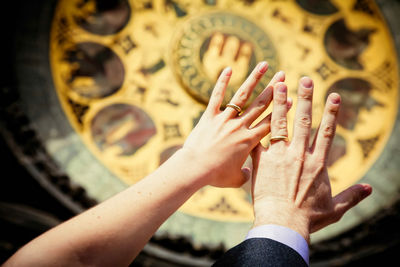 High angle view of hand touching blurred people