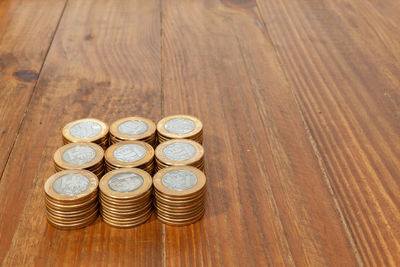 High angle view of coins on table