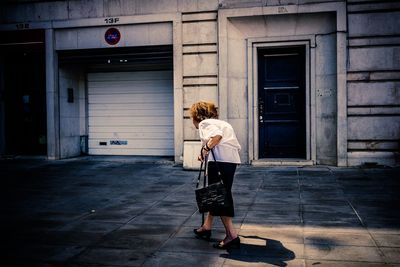 Senior woman walking on street