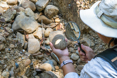 Low section of man standing on rock