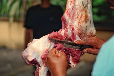 Workers are cutting beef