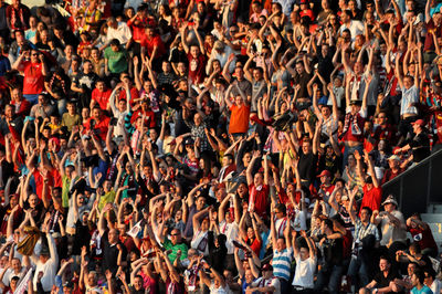 Full frame shot of spectators cheering at stadium