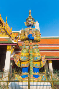 Low angle view of temple against building