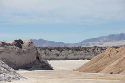 Scenic view of arid landscape against sky