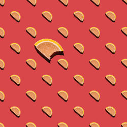 Seamless pattern from a photo of slices of marmalade on a pink background. wallpaper with sweets. 