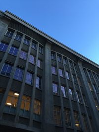 Low angle view of building against clear blue sky