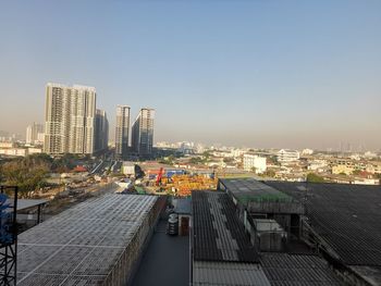 High angle view of buildings against clear sky