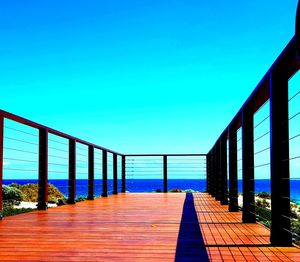 View of sea against clear blue sky