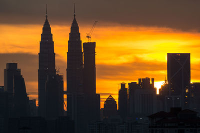 Silhouette of city at sunset