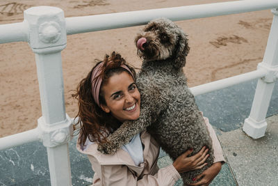 Portrait of happy woman with dog