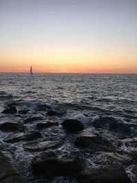 Scenic view of sea at sunset