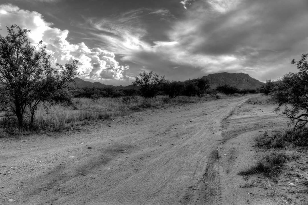 VIEW OF LANDSCAPE AGAINST CLOUDY SKY