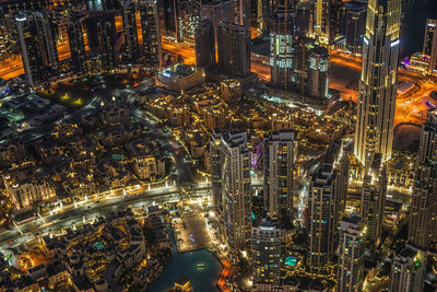 High angle view of illuminated buildings in city at night