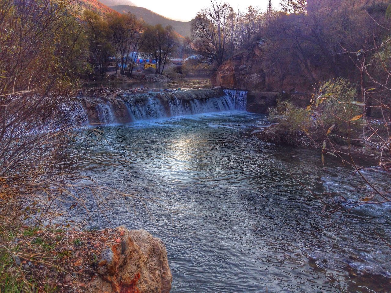 water, flowing water, tree, scenics, flowing, forest, nature, beauty in nature, river, waterfall, stream, tranquility, tranquil scene, waterfront, motion, rock - object, non-urban scene, idyllic, day, lake