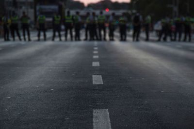 Police force standing on road