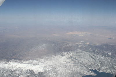 Aerial view of landscape and sea against sky