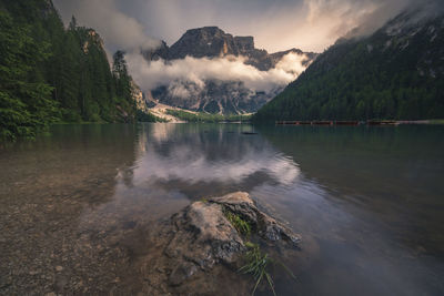 Scenic view of lake and mountains against sky