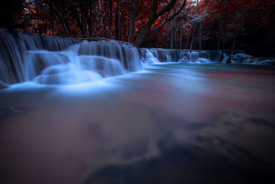 Scenic view of waterfall in forest