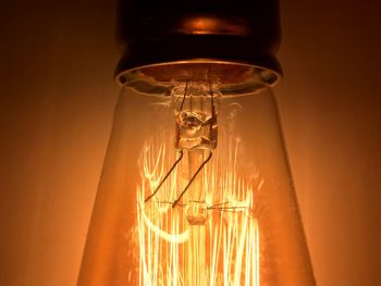 Close-up of illuminated light bulb