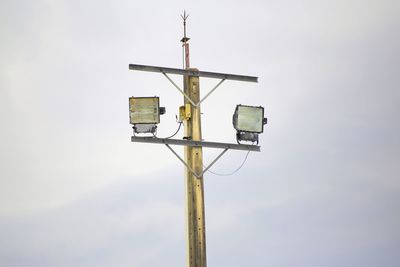 Low angle view of road sign against sky