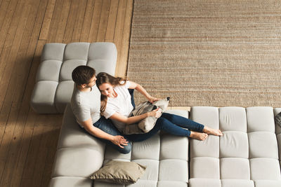 Young couple sitting on sofa