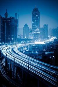 High angle view of illuminated buildings in city at night