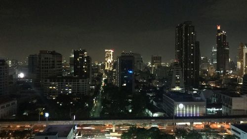 High angle view of illuminated buildings in city at night