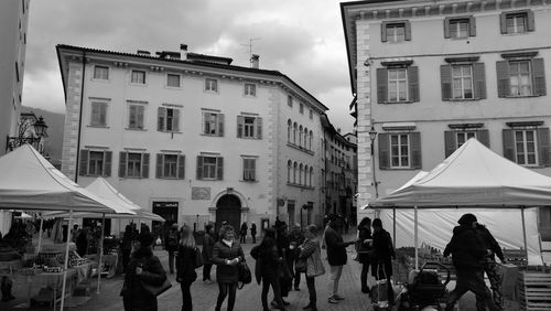 Group of people in front of buildings