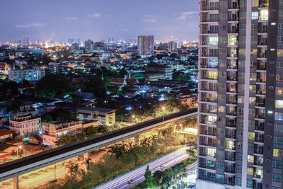 High angle view of illuminated buildings in city