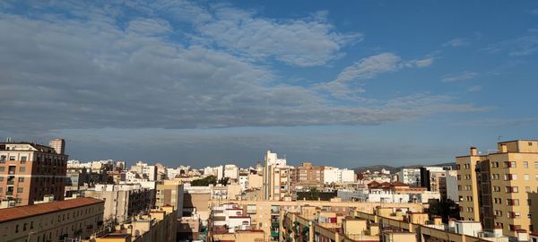 High angle view of buildings in city against sky