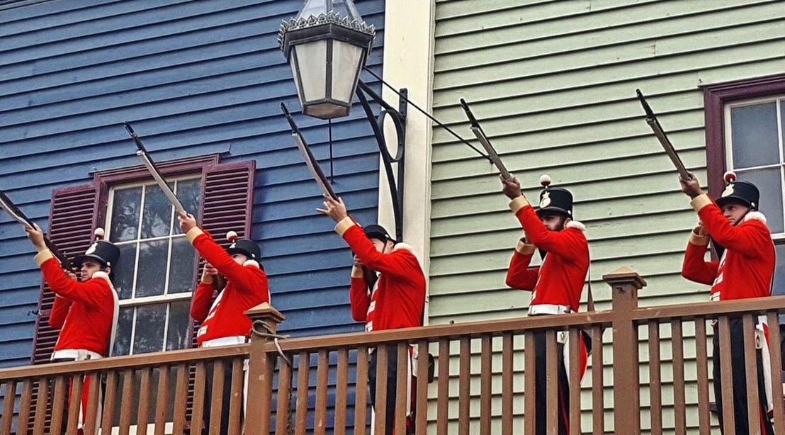 VIEW OF MEN WITH RED FLAGS